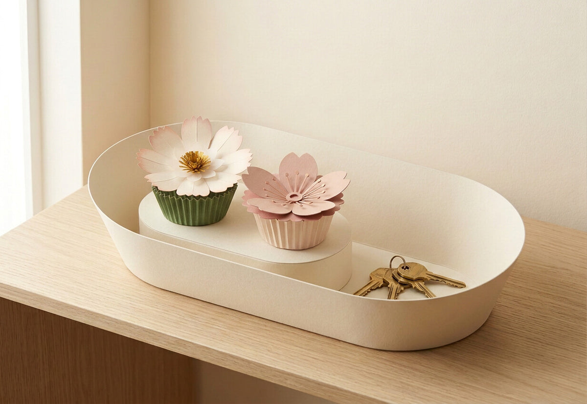 [CONCEPT PLACEHOLDER] Paper Flowers Duo: Daisy (Cosmos) and Sakura in the smooth flared oval cream card holder (AI concept render, not product photography)