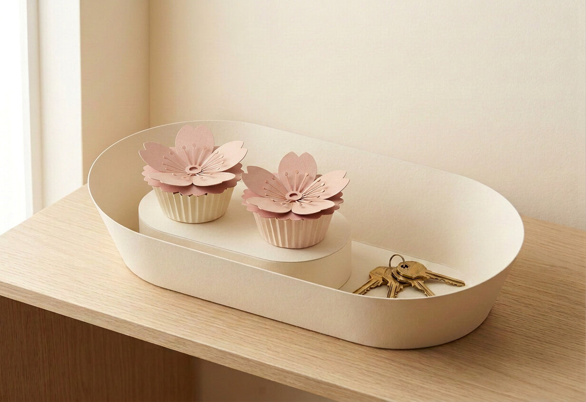 [CONCEPT PLACEHOLDER] Paper Flowers Duo: two Sakura in the smooth flared oval cream card holder (AI concept render, not product photography)