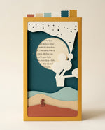Dear Pen Pal Pocket Story from the front: Noelani stands on the dunes below a white paper balloon, a handwritten letter behind the moon window