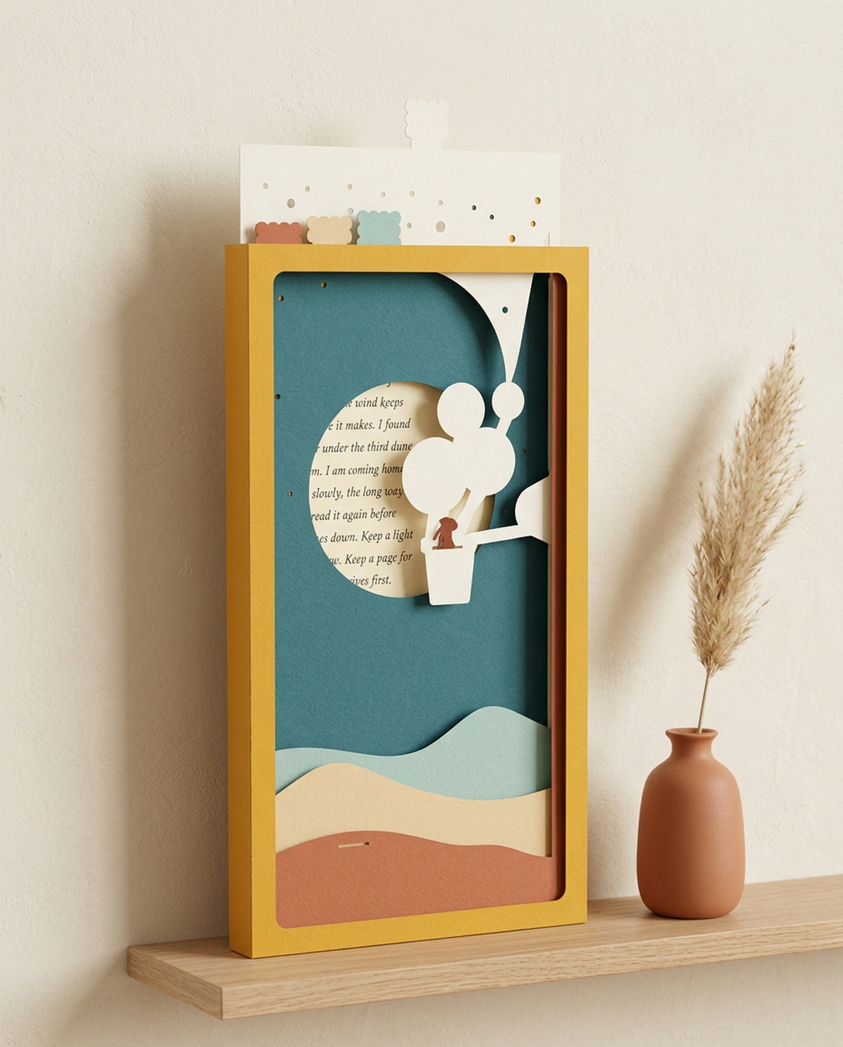 Dear Pen Pal Pocket Story on a wall shelf beside a terracotta vase, top layer raised out of the sleeve