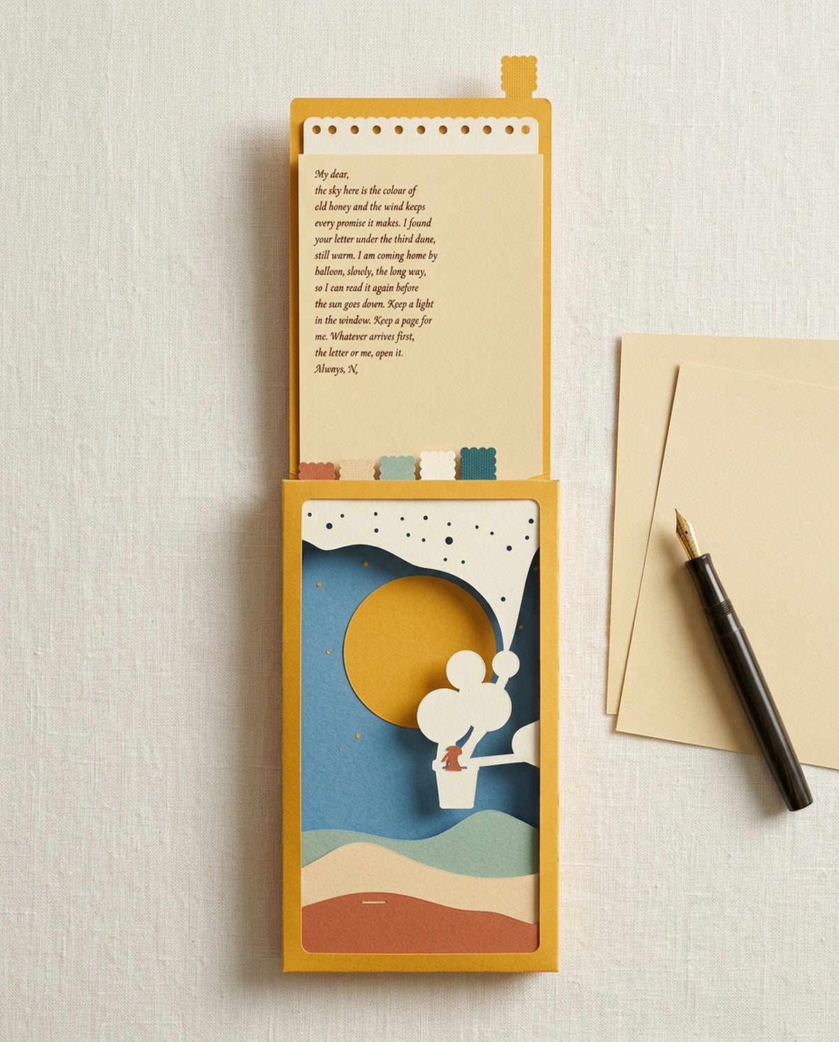 The handwritten letter pulled out of the Dear Pen Pal sleeve, the sky swapped to a golden sun, beside writing paper and a fountain pen