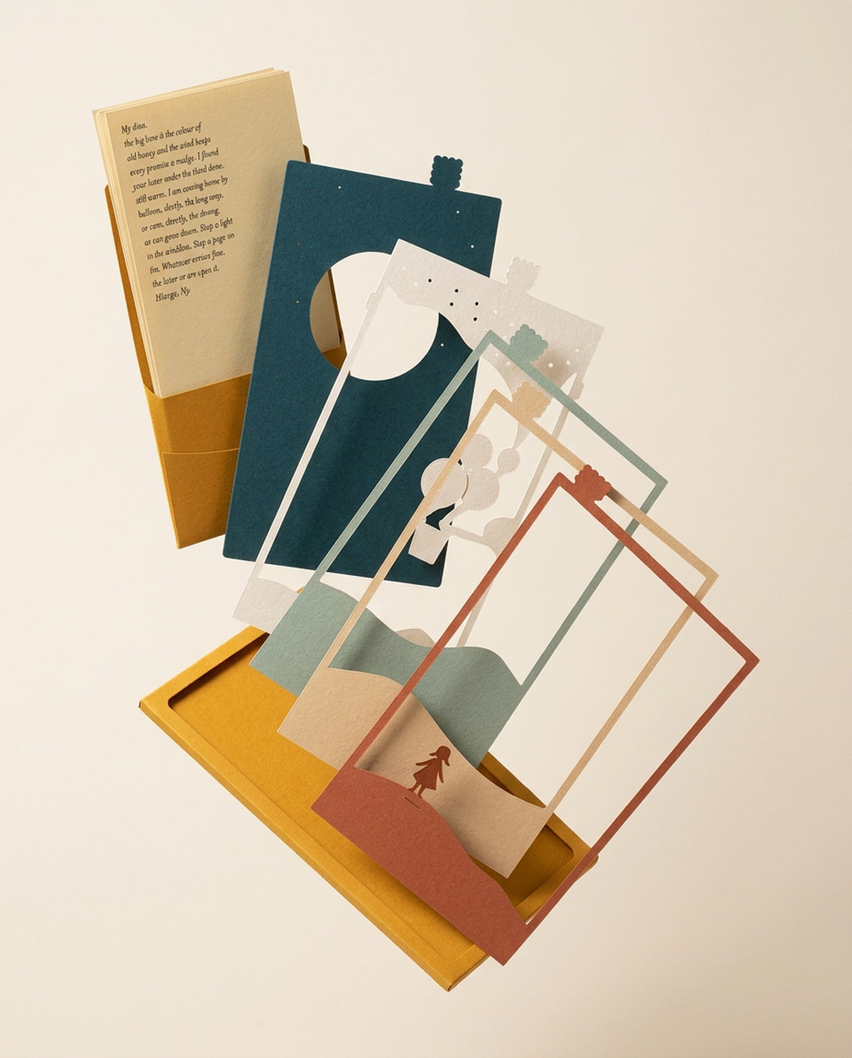 Dear Pen Pal Pocket Story taken apart: mustard sleeve, cut-paper layers and the letter card fanned out