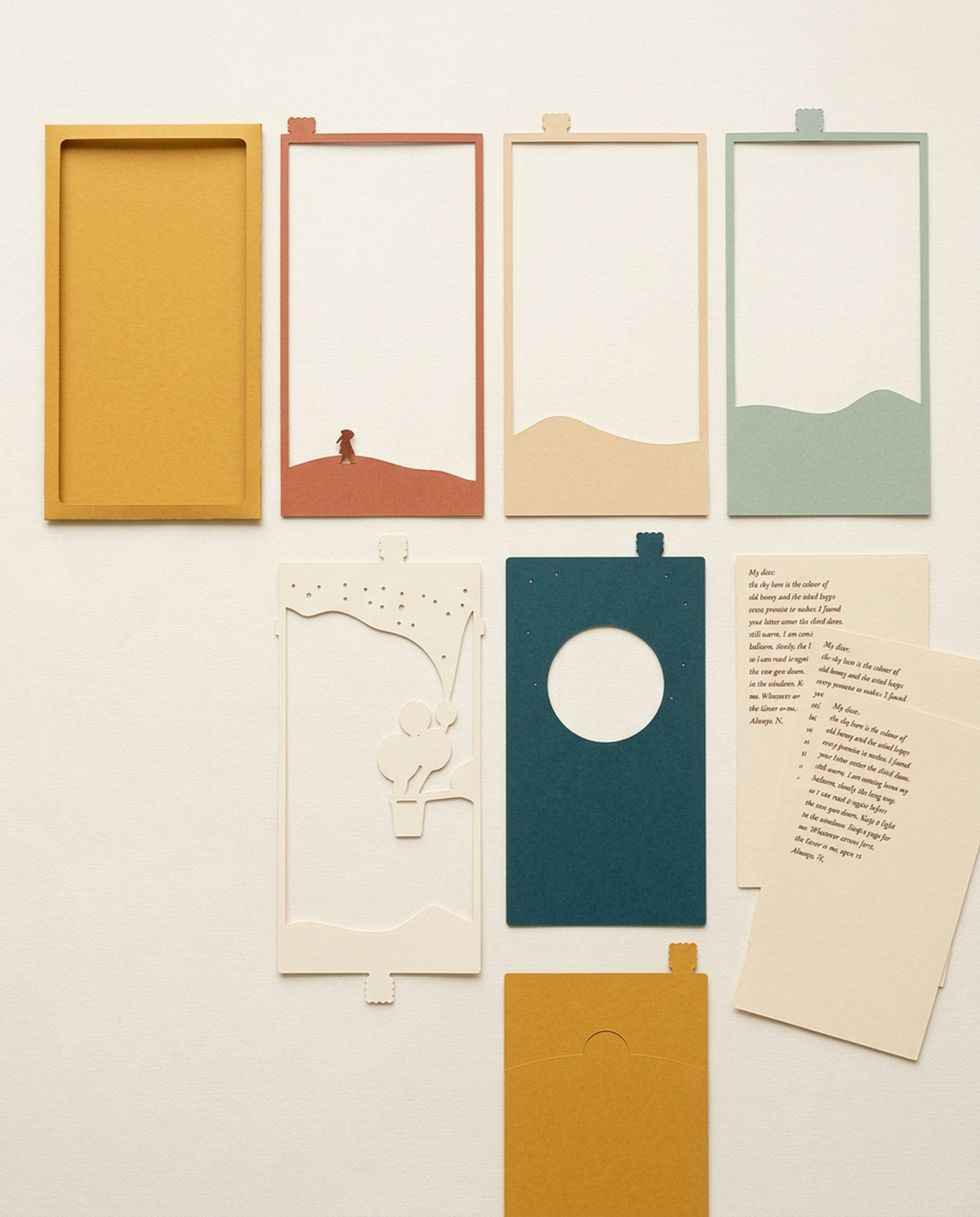 Every piece of the Dear Pen Pal Pocket Story laid flat: sleeve, cut-paper layers, letter cards and slide