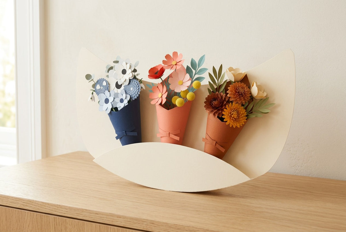 Paper Flowers Trio Landscapes of the Tale, three paper bouquets in a cream crescent, three-quarter view