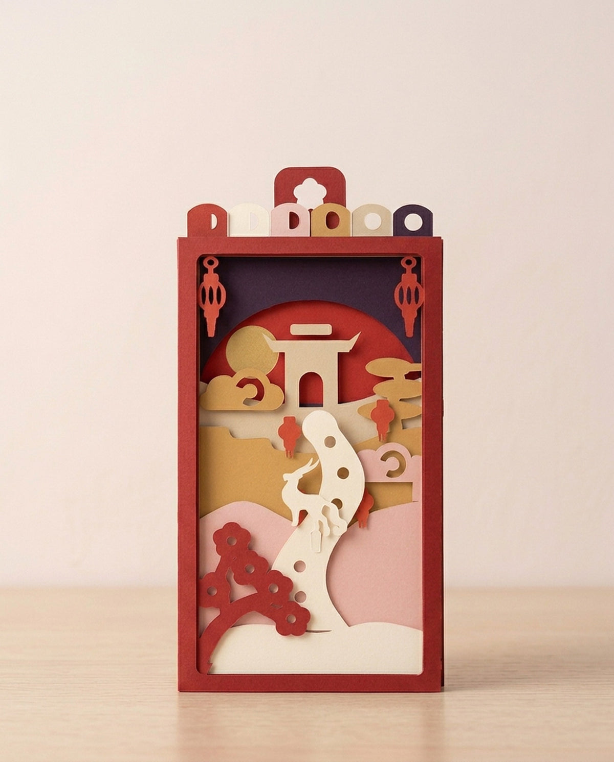 Year of the Goat Pocket Story assembled in its red sleeve, day mode, seen from the front
