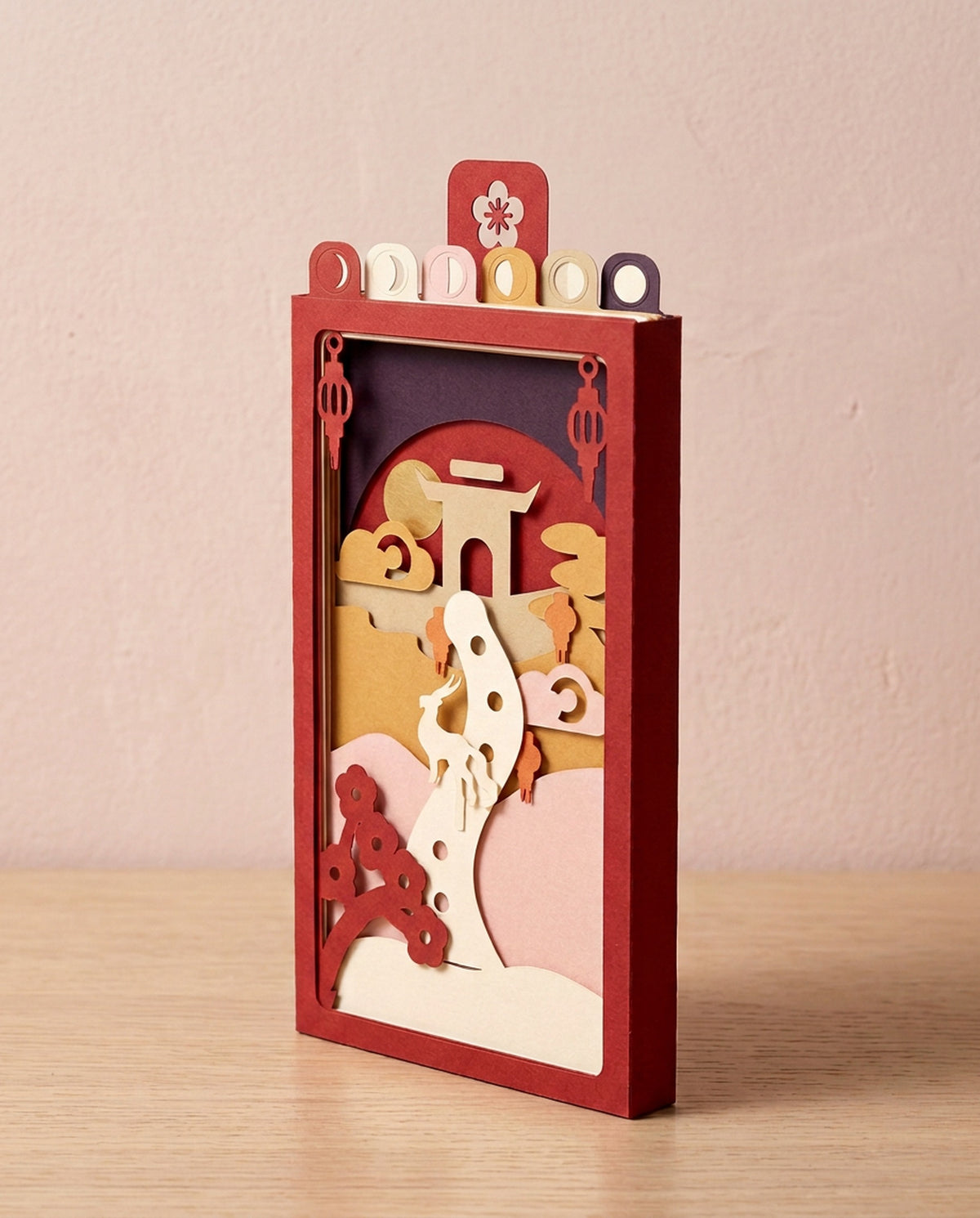 Year of the Goat Pocket Story from the side: a slim 1 cm red sleeve with six layer tabs